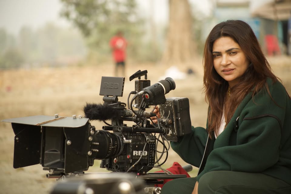 Krisha Chaulagain directing on set with a RED cinema camera